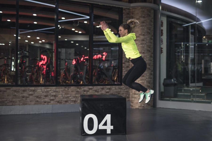 woman-exercising-with-box